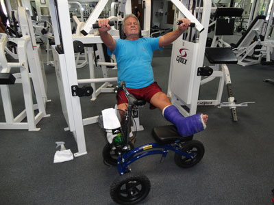 man exercising on knee walker