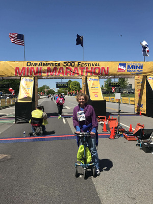 woman running on knee walker