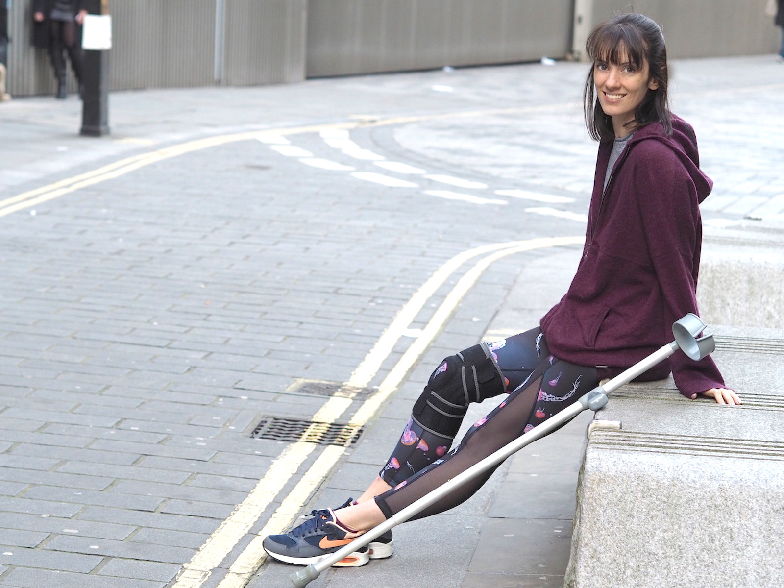 Woman exercising with crutches