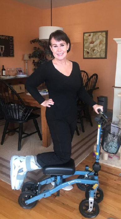 lady on a knee scooter at a home dining room