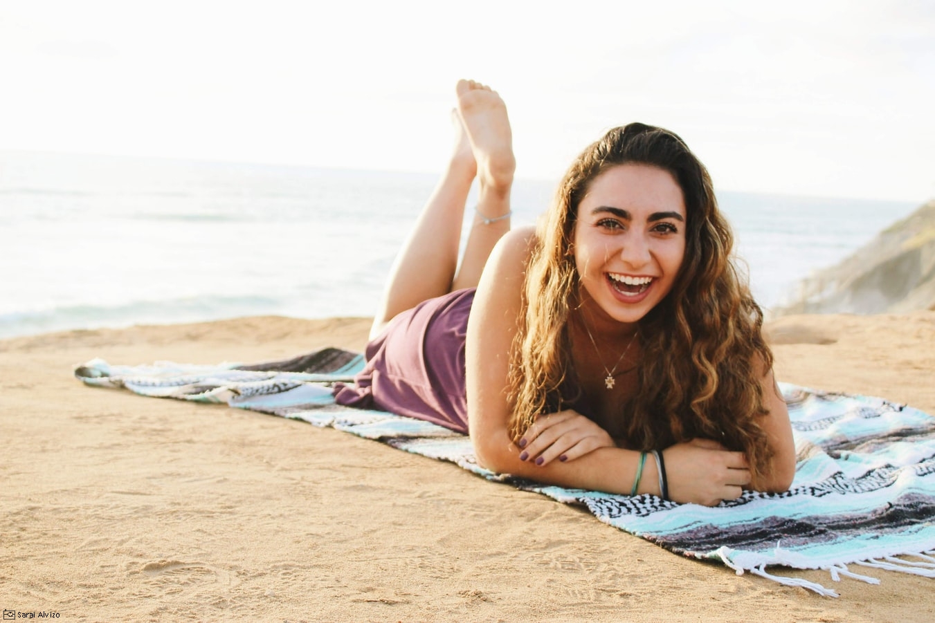 woman laying on beach