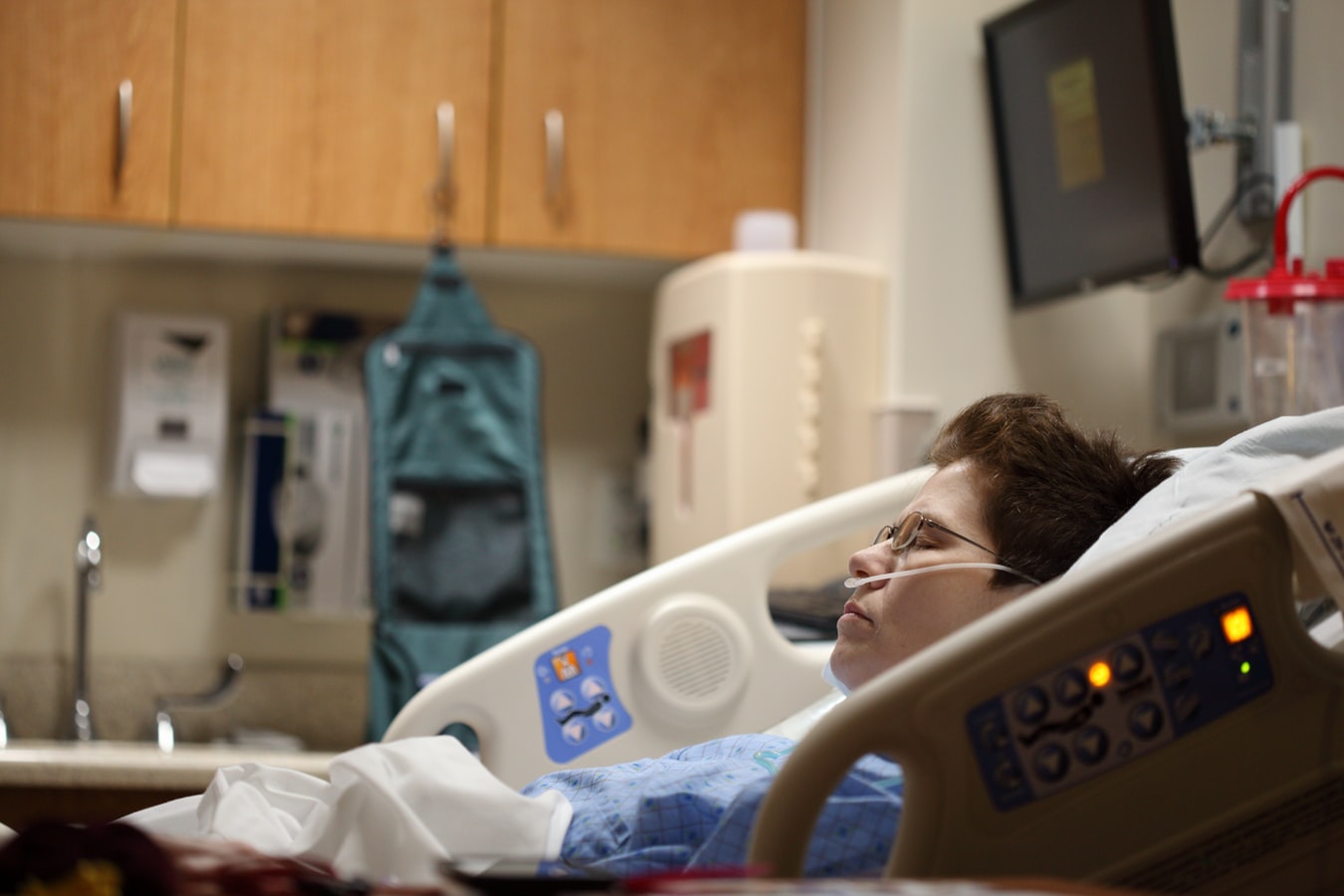 female patient in a hospital bed 
