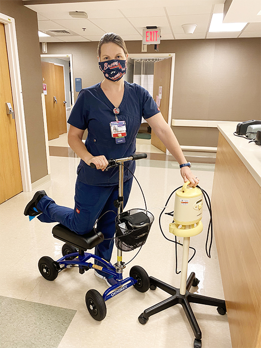 nurse on a knee scooter