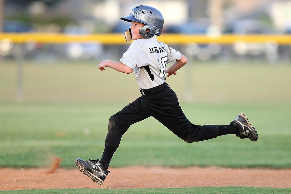 child playing baseball