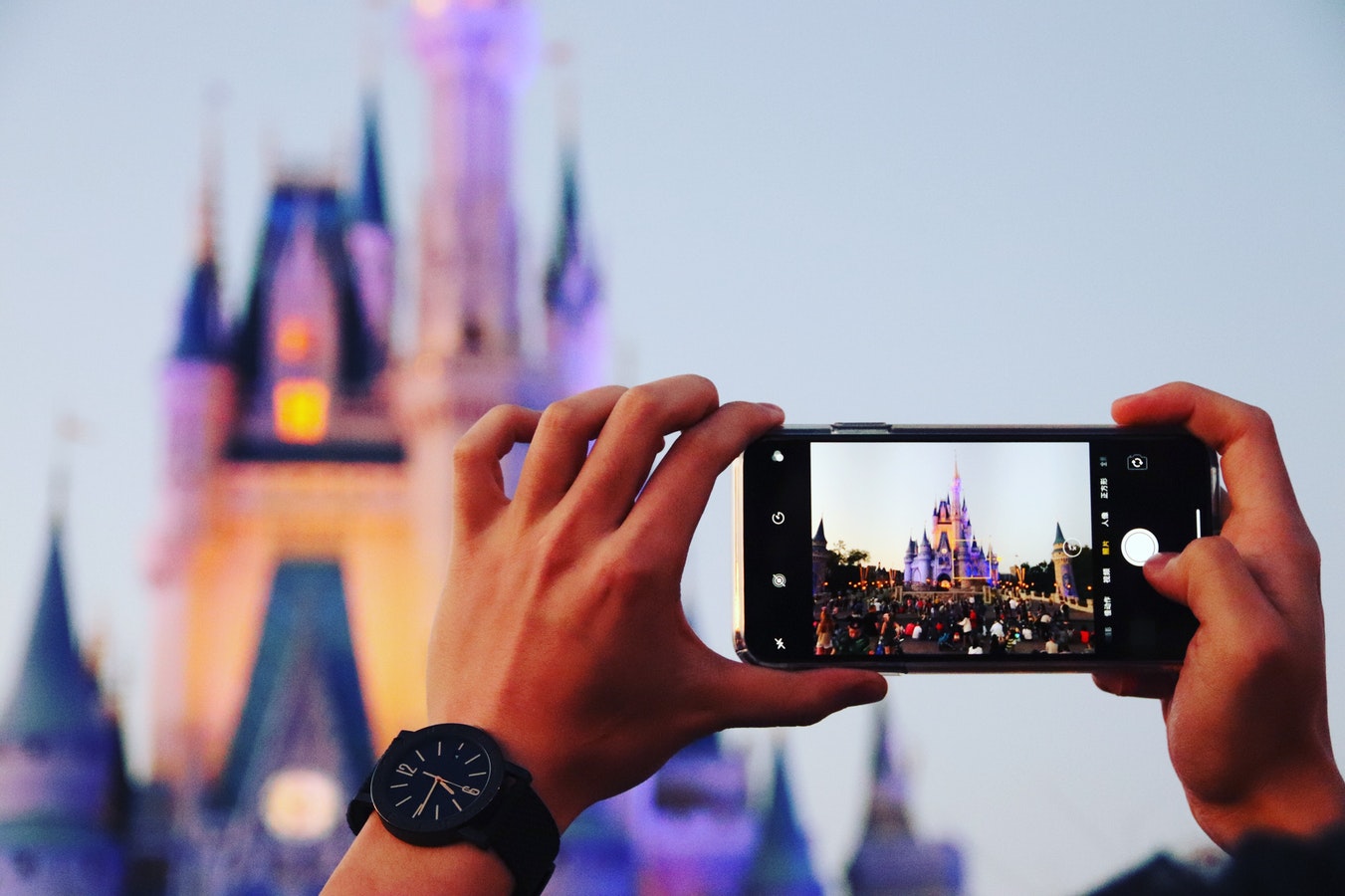 taking picture of Disney castle