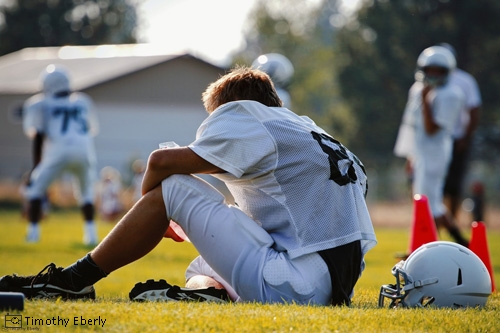 Football player sitting down