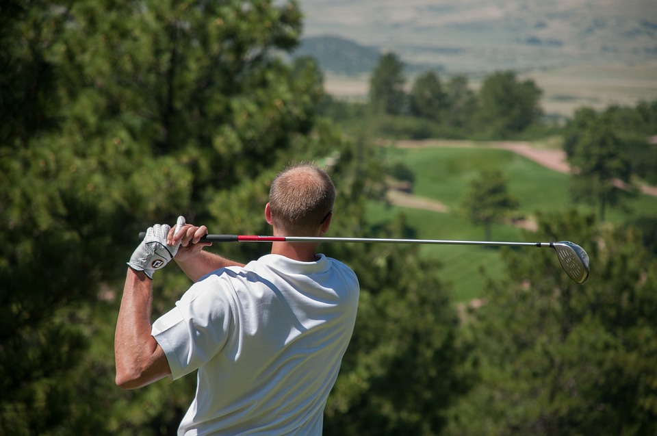 golfer swinging club