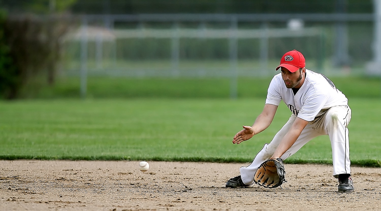 baseball player fielding ball