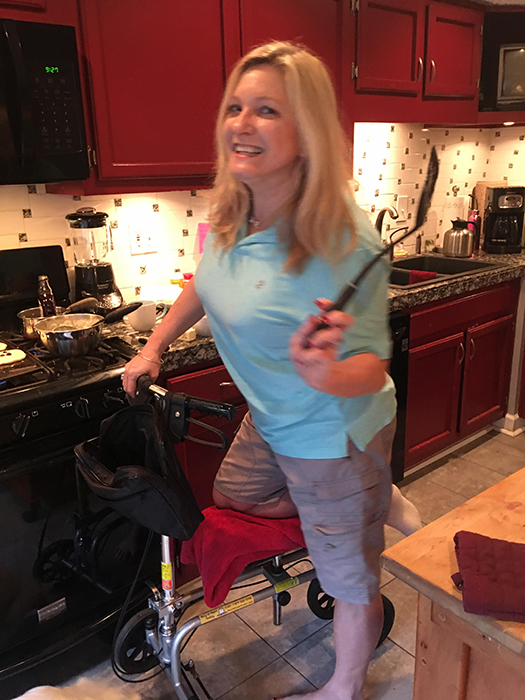 lady cooking on a knee scooter